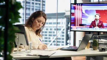 Enterprise director authorizing all work contracts and documents, signing paperwork as CEO with executive power. Solving all her legal obligations in high end office, leadership skills. Camera A. photo