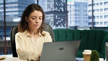 Confident female leader driven by empowerment and ambition, focuses on achieving business targets and enhancing company performance in a dynamic office setting. Leadership success story. Camera A. photo