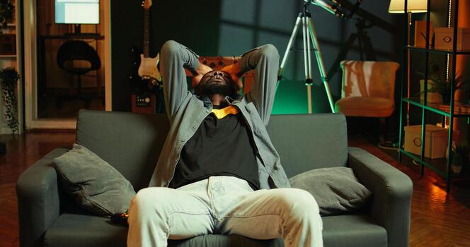 Annoyed man shouting after losing while playing online multiplayer videogame, frustrated by unhelpful teammates. Gamer raging after receiving game over message, upset with noob friends, camera B photo