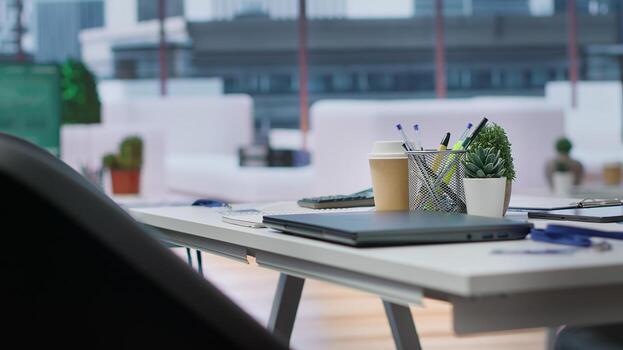 Empty corporate high end office prepared for job interviews and recruitment process, a computer displaying data and infographics. Business career development recruiting. photo