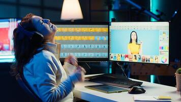 Freelancer dancing on chair while editing professional photographs, enjoying music. Photo editor bopping head on favorite tunes while using editing software, having fun, camera A
