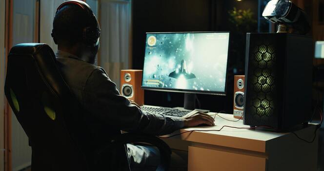 Man at home shooting asteroids in spaceship flying singleplayer game with overlay HUD showing health, fuel, ammo bars and minimap. Gamer navigating universe in simulation game, close up, camera B photo