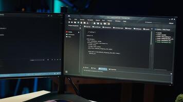 Programmer teleworking from own apartment filtering malicious traffic from cybercriminals attempting to corrupt company data using computer, preventing phishing attacks, camera A photo