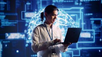 Smiling engineer in data center using artificial intelligence computing simulating human brain thought processes in computerized model. Happy worker works on laptop with AI machine learning algorithms photo
