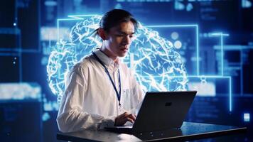 Efficient engineer in cloud computing company uses artificial intelligence computing simulating human brain. Focused admin running operations on laptop with AI machine learning algorithms photo