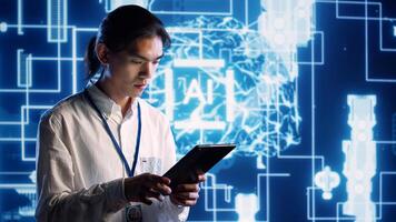 Asian developer using tablet to implement artificial intelligence parallel processing, breaking up complex computational tasks into smaller bits, enabling AI systems to process more input data faster photo