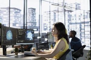 Developer conducting experiments and tests to optimize artificial intelligence machine learning models for performance and accuracy. IT specialist in office analyzing and interpreting complex AI data photo