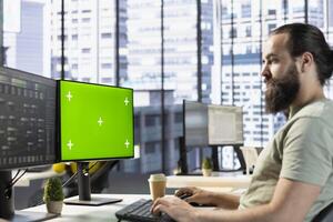 Technician conducting code review on isolated screen computer to fix bugs, identifying performance and technical issues with company software. IT expert optimizing code on chroma key PC photo