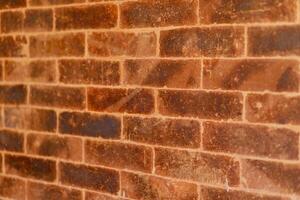 Close-Up of Rustic Red Brick Wall Texture Background photo