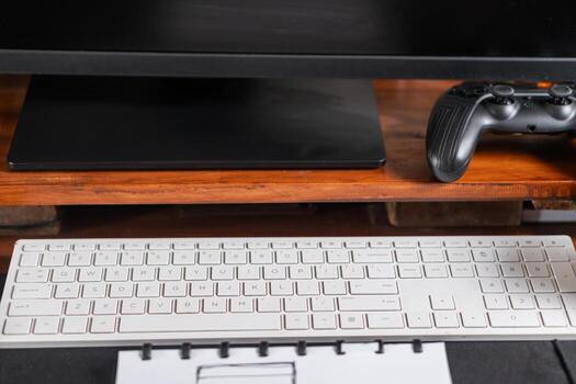 Modern Desk Setup With Keyboard And Game Controller photo