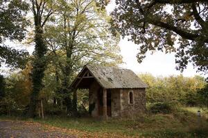 landscapes of an autumnal European village, Belgium, leaves colored by fall photo