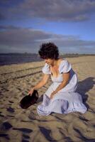 a young plus size woman walking and playing with her pet rabbit by the sea in Copenhagen photo