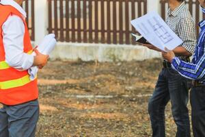 A team of engineers and architects joined together to enter the construction area to check the construction progress according to the plans that the team of engineers and designers had set out. photo