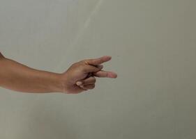 Finger spelling letter P in american sign language photo