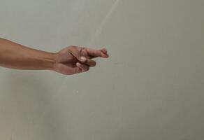 Finger spelling letter R in american sign language photo