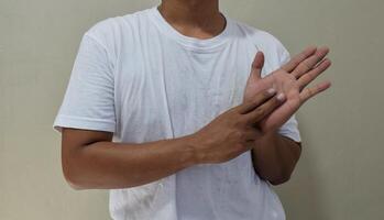 Lovely man showing a sign language, communication for deaf photo