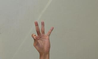 Man showing number nine in american sign language photo