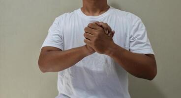 Young man believe in sign language, communication for deaf photo
