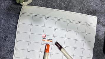 Don't Forget to Follow Up text white calendar background. Reminder or schedule concept photo