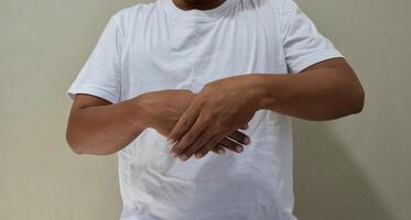 Young man learning sign language, communication for deaf photo