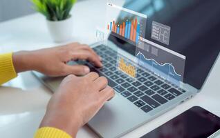 Business woman use computers to analyze business and manage corporate data, Business analytics with charts, Metrics and KPIs to improve organizational performance, financial organization strategy. photo