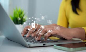 Cybersecurity and Global network security technology concept, Businesswoman protecting personal data on computer with virtual interface, Internet secure technology, Cyber security. photo
