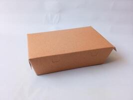 brown block-shaped cardboard box with isolate on white. packaging cardboard. photo