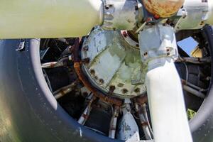 detail of old airplane engine with propeller photo
