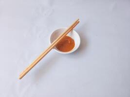 rendang chili sauce on white saucer isolate on white photo