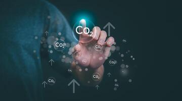 Ideas for reducing carbon emissions or using carbon credits for organizations. Businessman showing carbon credit and green business environmental conservation sustainable environmental development photo