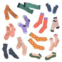 Collection of trendy cotton, woolen, and nylon socks with different patterns and textures. isolated flat illustrations on a white background. Clothing, apparel and garments set. vector