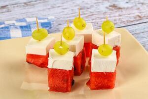 Watermelon with feta and grape photo