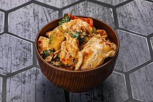 Thai red spicy curry with chicken photo