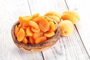 Dried apricot heap in the bowl photo
