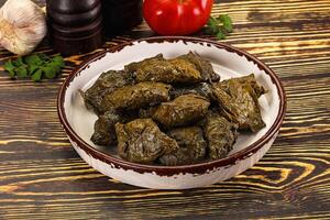Stuffed dolma - meat in grape leaves photo