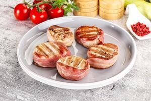 Grilled pork tenderloin with bacon photo