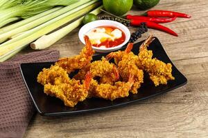 Golden deep prawn tempura wuth sauce photo