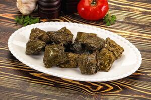 Stuffed dolma - meat in grape leaves photo