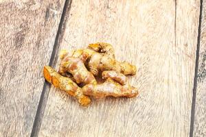 Fresh young Tumeric root heap photo