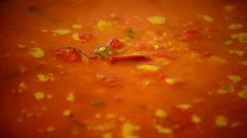 Paella food boiling in pan, Tomato soup or souce boil, close up video