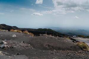 Etna, in Sicilian Muncibbe, is a complex stratovolcano of Sicily that originated in the Quaternary, and is the highest active volcano of the Eurasian plate. photo