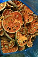 Bael fruits are of dietary use and the fruit pulp is used to prepare delicacies like murabba, puddings and juice photo