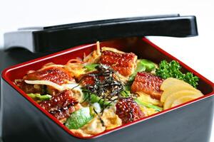 Unagi Toji Don, Grilled unagi with egg, mushroom, onion served in rice box photo
