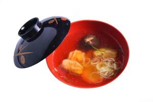 Japanese Clear Soup in red bowl style isolated on white background photo