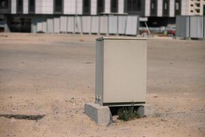 Gray metallic box with supplies at the construction site. iron container. photo