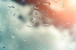 Water drops on glass against blue sky. Window view background screensaver. Place for text banner. photo