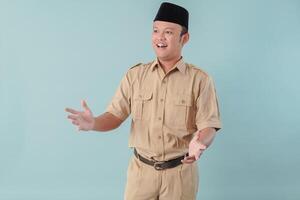 Handsome Indonesian government worker man wearing khaki uniform gesturing and having conversation. photo