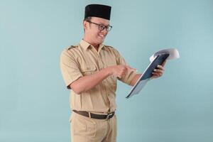 Young government worker man reading document paper or report with serious expression. photo