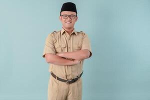 Confident government worker man wearing khaki uniform smiling and standing with his arms crossed. photo