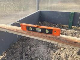 Installing wooden beds in a greenhouse photo